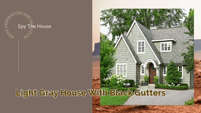 light gray house with black gutters